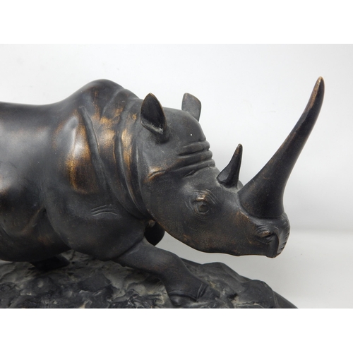 403 - Large Sculpture of a Rhinoceros on stand: Measuring 36cm wide