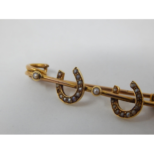 56 - Victorian 15ct Gold Horseshoe Brooch Set with Seed Pearls: Gross weight 1.8g