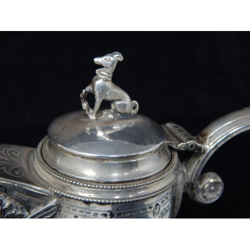 71 - Continental Cut Glass Claret jug with Bacchus Mask, Hinged Lid with Hound Finial & Scroll Handle.