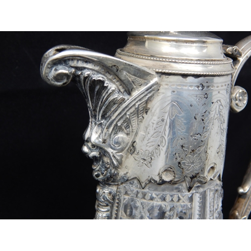 71 - Continental Cut Glass Claret jug with Bacchus Mask, Hinged Lid with Hound Finial & Scroll Handle.