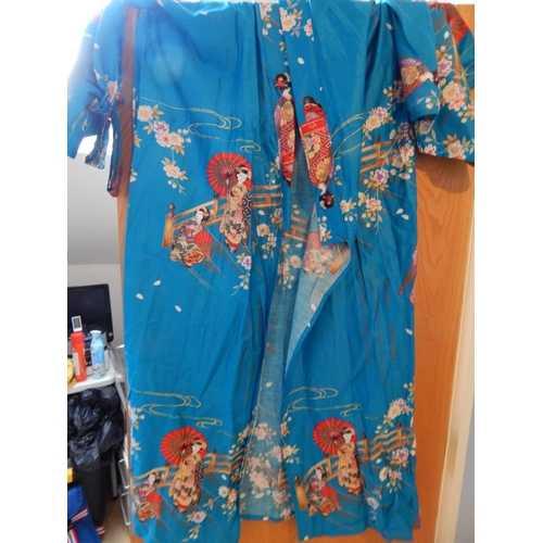 504 - Japanese Kimono with Scenes of Geisha Girls on Blue Ground.