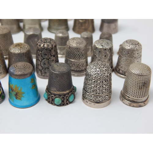 74 - A Collection of 23 Hallmarked Silver Thimbles Including examples by Charles Horner together with fur... 