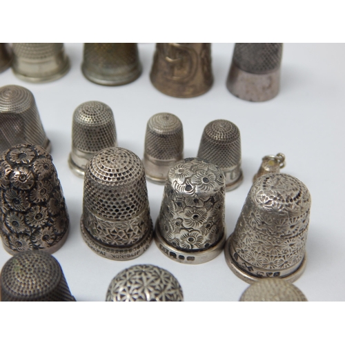 74 - A Collection of 23 Hallmarked Silver Thimbles Including examples by Charles Horner together with fur... 