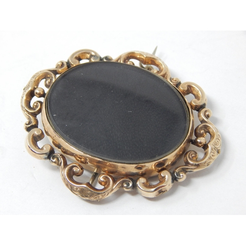 77 - A Large Victorian Gold Framed Double Sided Mourning Brooch: 5.5cm x 4.5cm: Gross weight 20.24g