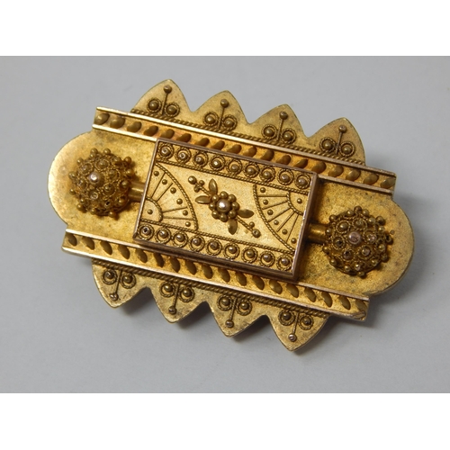 78 - A Victorian Yellow Metal Mourning Brooch with reverse Hair Panel: 4cm wide: Gross weight 11.16g