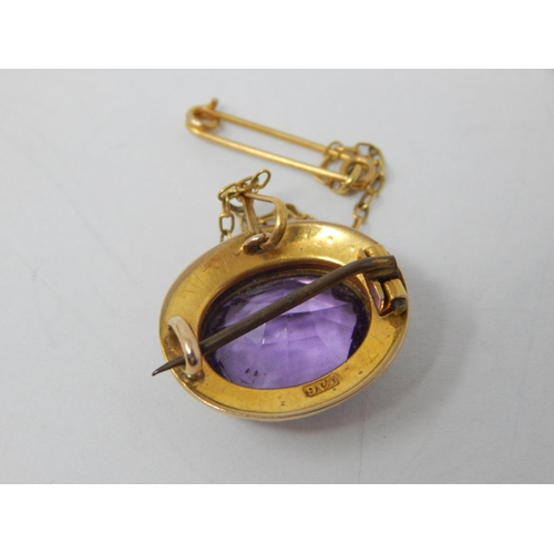 87 - Victorian 9ct Gold Brooch Set with a Central Amethyst within a Seed Pearl Border with safety Chain.