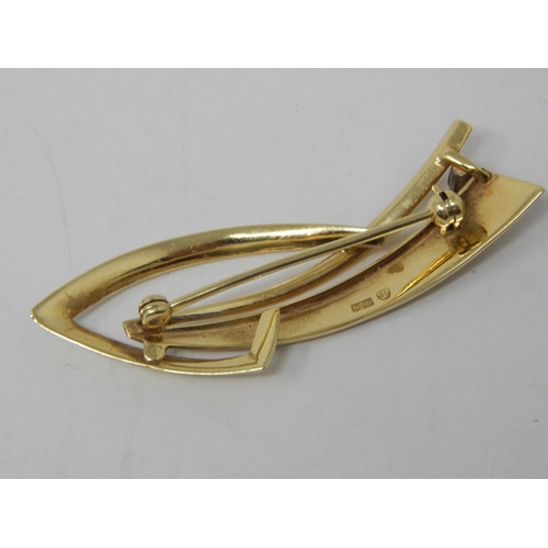 88 - 14ct Yellow Gold Modernist Brooch Set with a Sapphire: 5.2cm wide: Weight 6.09g