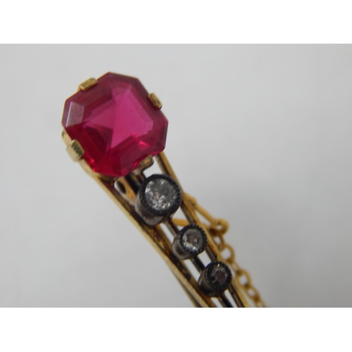 91 - Victorian 15ct Gold Brooch Set with a Ruby Estimated @ 2.0cts above three graduated collet set Diamo... 