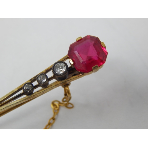 91 - Victorian 15ct Gold Brooch Set with a Ruby Estimated @ 2.0cts above three graduated collet set Diamo... 