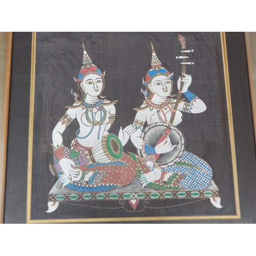 497 - A Pair of Framed & Glazed Thai Silk Figural Pictures: Each Measuring 44cm x 44cm overall