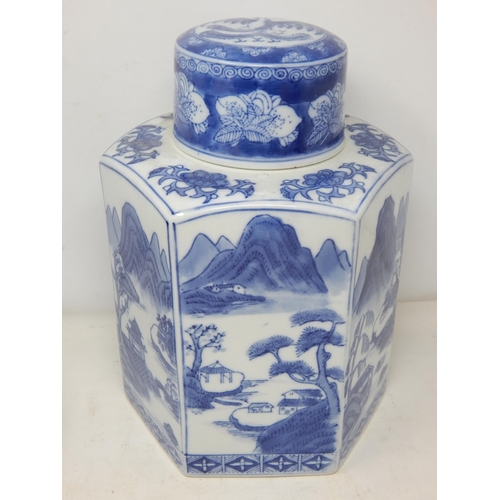 528 - Large Oriental Octagonal Blue & White Lidded Pot with Scenes of Pagodas in a Landscape. Height 27cm