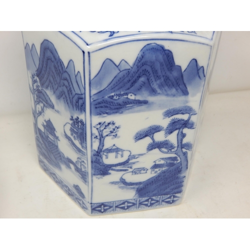 528 - Large Oriental Octagonal Blue & White Lidded Pot with Scenes of Pagodas in a Landscape. Height 27cm