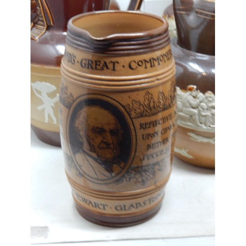 530 - Large Collection of Doulton Lambeth Stoneware Jugs Including a William Gladstone Example.