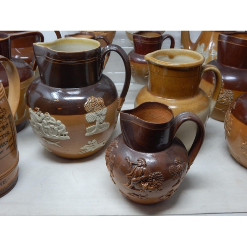 530 - Large Collection of Doulton Lambeth Stoneware Jugs Including a William Gladstone Example.