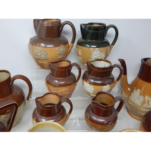 530 - Large Collection of Doulton Lambeth Stoneware Jugs Including a William Gladstone Example.