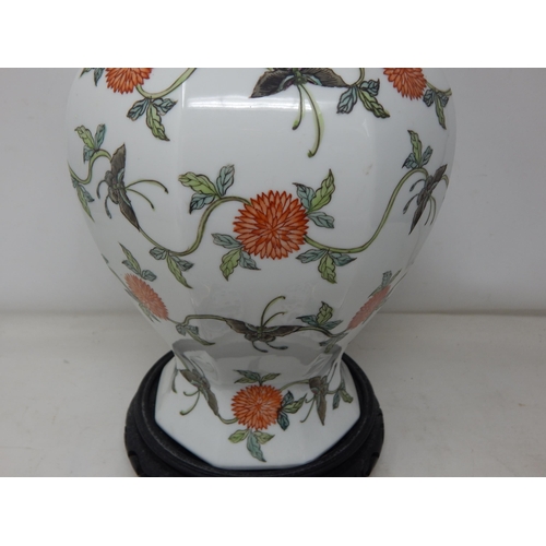 534 - A Large Chinese Lidded Vase (40cm) with Swags of foliate decoration on carved wooden stand together ... 