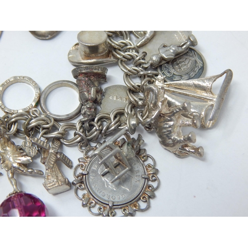 162 - Heavy Silver Charm Bracelet with Numerous Attached Charms: Gross weight 105g