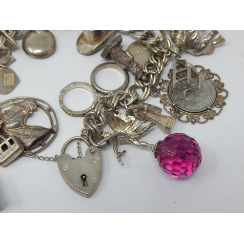 162 - Heavy Silver Charm Bracelet with Numerous Attached Charms: Gross weight 105g