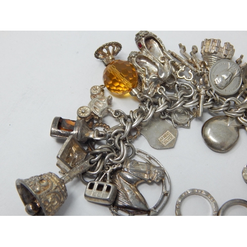 162 - Heavy Silver Charm Bracelet with Numerous Attached Charms: Gross weight 105g