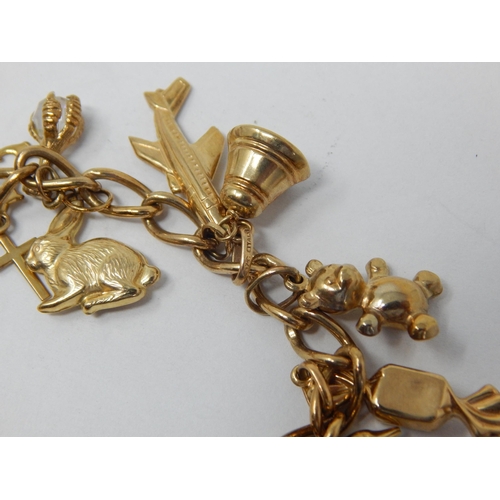 163 - 9ct Yellow Gold Charm Bracelet with Numerous Attached Charms: Gross weight 22.03g