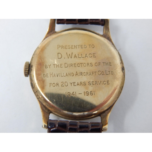 169 - GARRARD: Gentleman's 9ct Gold Wristwatch with subsidiary seconds dial on brown leather strap. Workin... 