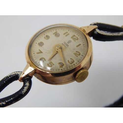 174 - TUDOR: Ladies 9ct Gold Tudor Royal on Black Leather Strap: Ticking when catalogued.