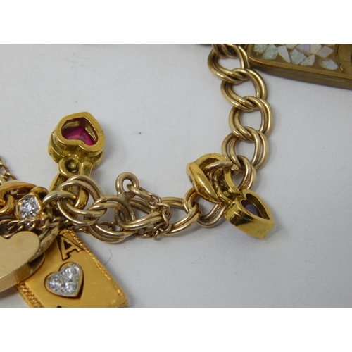 189 - 9ct Yellow Gold Charm Bracelet with Numerous Charms: Gross weight 22.47g