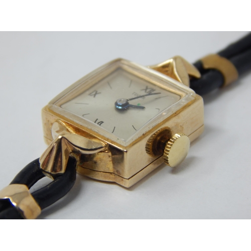 192 - TUDOR: 9ct Gold Ladies Tudor Wristwatch with Square Dial on Black Leather Strap & Original Guarantee... 