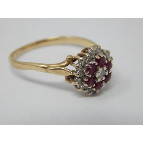 297 - 9ct Yellow Gold Ring Set with a Central Diamond within borders of Rubies & Diamonds: Size P/Q: Gross... 