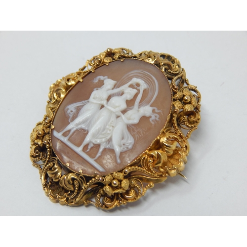 298 - Victorian Gold Framed Cameo Brooch Carved as The Three Graces with Safety Chain: Measures 5cm x 4cm