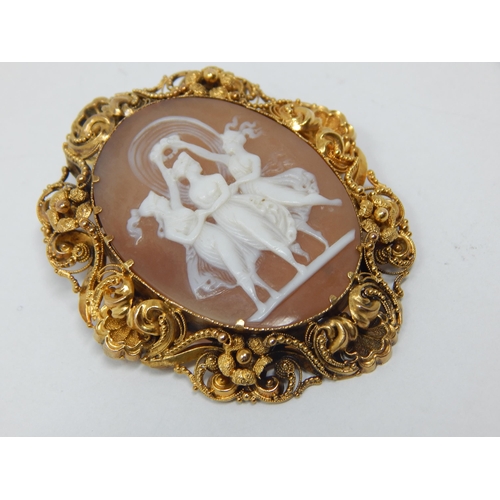 298 - Victorian Gold Framed Cameo Brooch Carved as The Three Graces with Safety Chain: Measures 5cm x 4cm