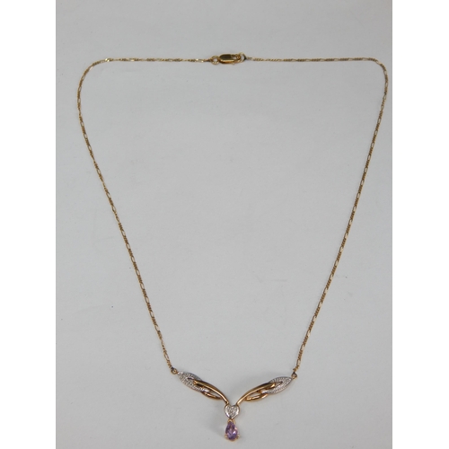 344 - 9ct Yellow Gold Pendant Necklace Set with Diamonds and an En Tremblant Amethyst: Length 40cm