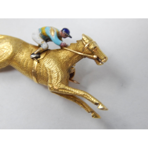 357 - Unmarked 18ct Yellow Gold Brooch Formed as a Racehorse with Enamel Jockey: 3.2cm wide: Weight 6.49g