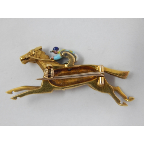 357 - Unmarked 18ct Yellow Gold Brooch Formed as a Racehorse with Enamel Jockey: 3.2cm wide: Weight 6.49g