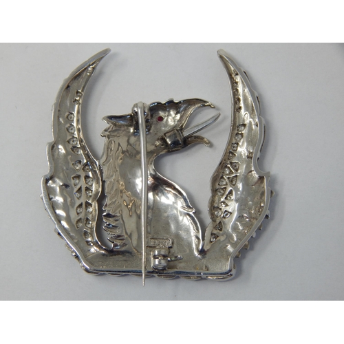 375 - 18ct White Gold Brooch Formed as a Phoenix Set with Diamond Encrusted Wings & a Ruby Eye: Measures 3... 