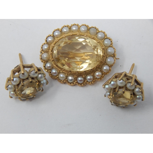 9ct Yellow Gold Brooch Set with a Central Citrine within a pearl border together with a similar pair of earrings.