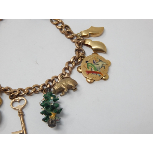 407 - 9ct Yellow Gold Charm Bracelet with numerous charms (one silver): Gross weight 46.6g