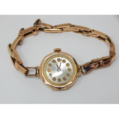 63 - 9ct Gold Ladies wristwatch on on 9ct Gold expandable bracelet gross weight 18.61g.