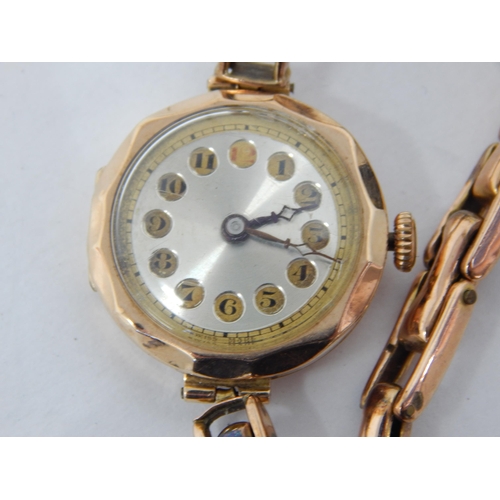 63 - 9ct Gold Ladies wristwatch on on 9ct Gold expandable bracelet gross weight 18.61g.