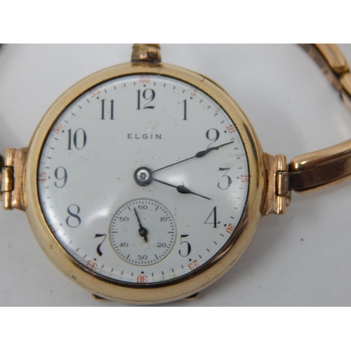 64 - 9ct Gold Elgin wristwatch on 9ct Gold expandable bracelet gross weight 33.70g.