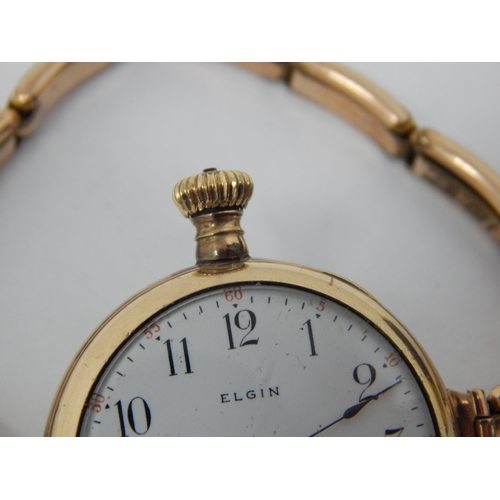 64 - 9ct Gold Elgin wristwatch on 9ct Gold expandable bracelet gross weight 33.70g.