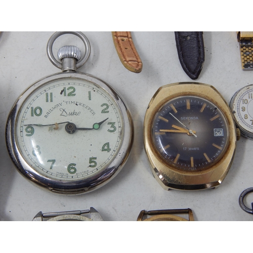 37 - A large collection of vintage wristwatches and a pocket watch and lighter