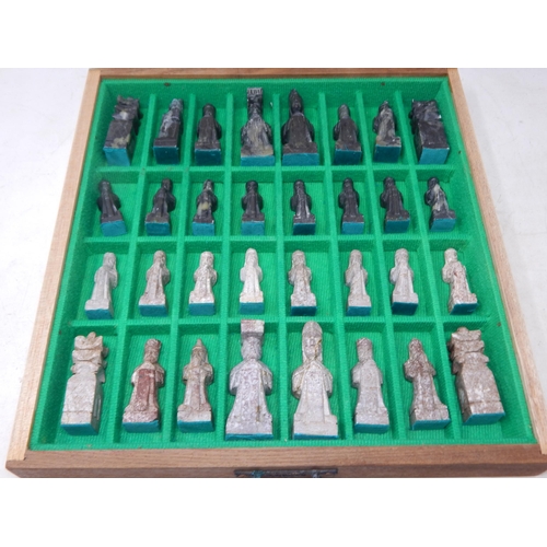 612 - Chess Set: The Pieces Carved from Soapstone & contained within a drawered chess board cabinet