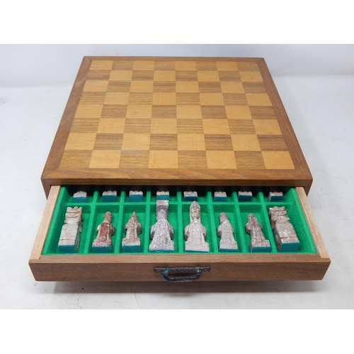 612 - Chess Set: The Pieces Carved from Soapstone & contained within a drawered chess board cabinet