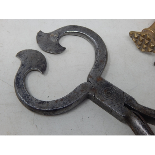 617 - A Pair of Large Antique Steel Sugar Cutters together with two leather working tools.