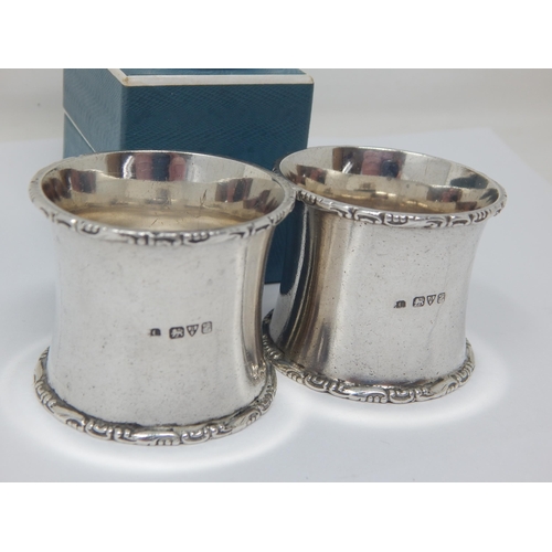 105 - A Pair of Heavy Silver Napkin Rings Hallmarked Chester 1911 together with an Edwardian Silver Napkin... 