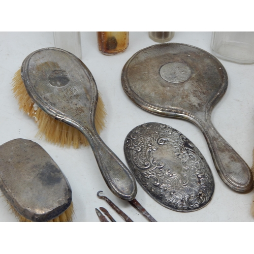 176 - A Quantity of Silver Mounted Dressing Table Jars, Hand Mirror & Brushes: Various Dates & Makers