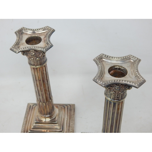 179 - A Pair of Late C19th Silver Plated Corinthian Column Candlesticks with removeable Sconces: Height 22... 