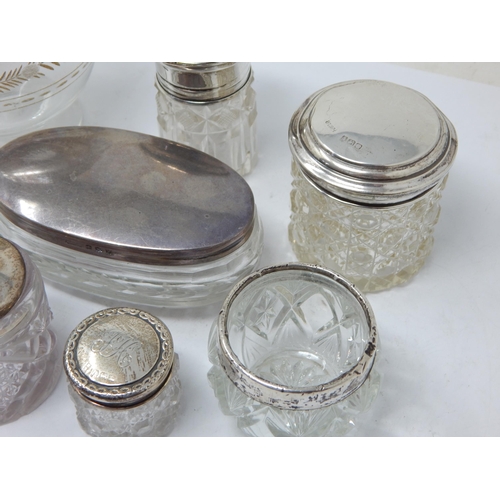 166 - A Group of Hallmarked Silver Mounted Dressing Table Jars, Match Striker etc: Various Dates & Makers