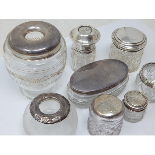 166 - A Group of Hallmarked Silver Mounted Dressing Table Jars, Match Striker etc: Various Dates & Makers